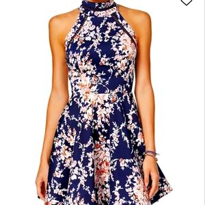 B Darlin dresses up your seasonal look with this printed fit & flare dress.